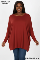 Zenana plus-size sweater-fabric oversize round-neck poncho in brick red with long sleeves and a relaxed drape.