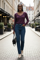 Premium rayon long-sleeve V-neck tee in plum purple, relaxed-fit, worn with dark jeans and beige ankle boots