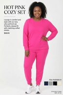 Women's hot pink cozy lounge set with round-neck top and matching jogger pants.