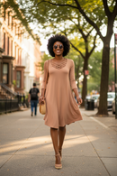 ZENANA Egg Shell Long Sleeve Dress with Crisscross Neckline on a city street.